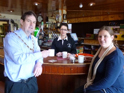 Cllr Donal Cunningham with Teresa McCurdy of McCuaig's Bar, Rathlin Island and Jessica Bates of the island's Fairtrade Group._0.jpg